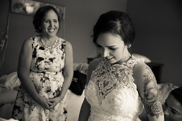 Mom looking at daughter wedding photos