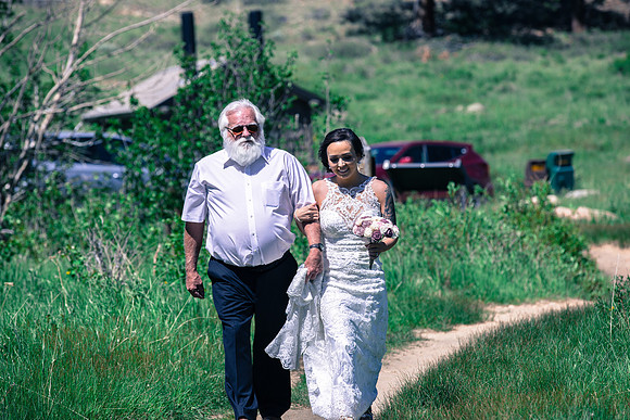 Bride and dad walking down aisle